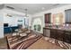 Eat-in kitchen with stainless appliances, granite counters and access to outdoor deck at 329 Chamberlain Dr, Clayton, NC 27527