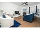 Living room with hardwood floors, modern furnishings, and fireplace at 329 Chamberlain Dr, Clayton, NC 27527