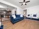 Comfortable living room featuring hardwood floors, an open concept, and an accent wall at 329 Chamberlain Dr, Clayton, NC 27527