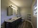 The spacious bathroom features a double vanity and ample lighting at 35 Fairway Ct, Dunn, NC 28334