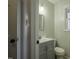 Updated bathroom with stylish vanity, mirror, window, light fixture and toilet at 35 Fairway Ct, Dunn, NC 28334
