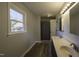 Bathroom features double sinks, neutral paint, modern lighting, and spacious layout at 35 Fairway Ct, Dunn, NC 28334