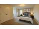 Spacious bedroom features neutral paint, a large window, and comfortable queen sized bed at 35 Fairway Ct, Dunn, NC 28334