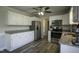 Well-equipped kitchen featuring stainless appliances, a granite countertop, and laminate flooring at 35 Fairway Ct, Dunn, NC 28334