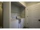 A laundry room with a washer, dryer, and a broom at 35 Fairway Ct, Dunn, NC 28334