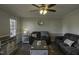 Comfortable living room with laminate flooring, modern lighting, and neutral wall color at 35 Fairway Ct, Dunn, NC 28334