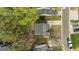 Overhead shot of a house, nestled among trees with neighborhood streets and driveways clearly visible from above at 3717 Phillips W Way, Durham, NC 27713