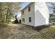 A spacious backyard features an open patio area and plenty of room to play at 3717 Phillips W Way, Durham, NC 27713