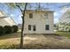A level backyard features an open patio area and lots of room to play at 3717 Phillips W Way, Durham, NC 27713