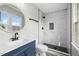 Stylish bathroom features new vanity, round mirror, glass shower and modern fixtures at 3717 Phillips W Way, Durham, NC 27713