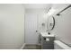 Charming bathroom features new vanity, round mirror and contemporary fixtures at 3717 Phillips W Way, Durham, NC 27713