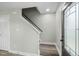 Front entry features hardwood floors, stairs, white trim, and a stylish front door at 3717 Phillips W Way, Durham, NC 27713