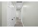 Hallway featuring hardwood floors, neutral paint, and access to a bathroom at 3717 Phillips W Way, Durham, NC 27713