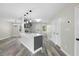 Open concept kitchen featuring an island, stainless steel appliances, and hardwood flooring at 3717 Phillips W Way, Durham, NC 27713