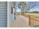 Spacious wooden back deck with scenic views of the surrounding landscape, including mature trees and fields at 3808 Johnson Pond Rd, Apex, NC 27539