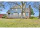 Charming blue home with a large wooden deck overlooking the backyard, perfect for relaxation and entertaining at 3808 Johnson Pond Rd, Apex, NC 27539
