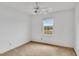 Carpeted bedroom with a window that offers natural light and outdoor views at 3808 Johnson Pond Rd, Apex, NC 27539