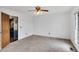Minimalist bedroom with carpet, natural light, and easy access to kitchen, waiting for personal touches at 3808 Johnson Pond Rd, Apex, NC 27539