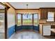 Charming dining area with a bay window showcasing scenic views of the expansive green yard at 3808 Johnson Pond Rd, Apex, NC 27539