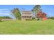 Charming two-story home featuring blue siding, red shutters and a cozy front porch at 3808 Johnson Pond Rd, Apex, NC 27539