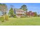 Charming two-story home featuring blue siding, red shutters and a cozy front porch at 3808 Johnson Pond Rd, Apex, NC 27539