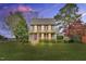 Charming two-story home featuring blue siding, red shutters and a cozy front porch at 3808 Johnson Pond Rd, Apex, NC 27539