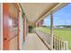 Inviting front porch with white railing and views of the expansive front yard at 3808 Johnson Pond Rd, Apex, NC 27539