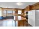 Spacious kitchen with wood cabinets, central island, and a bay window for enjoying scenic views at 3808 Johnson Pond Rd, Apex, NC 27539