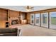 Bright living room with brick fireplace, built-in shelves, and French doors leading to outdoor space at 3808 Johnson Pond Rd, Apex, NC 27539