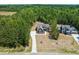 Aerial view of the property showcasing its location nestled among trees at 390 Pilot Ridge Rd, Zebulon, NC 27597