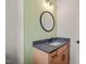 Bathroom showcases a vanity with storage, updated lighting, and a designer mirror for a stylish touch at 390 Pilot Ridge Rd, Zebulon, NC 27597
