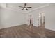 Spacious bedroom with a tray ceiling, fan, and multiple doorways, offering a comfortable and open layout at 390 Pilot Ridge Rd, Zebulon, NC 27597