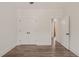 Bedroom boasts double doors, a ceiling fan, and wood-look floors, offering flexibility and comfort at 390 Pilot Ridge Rd, Zebulon, NC 27597