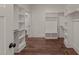 Spacious walk-in closet with custom shelving and wood-look floors offering ample storage space at 390 Pilot Ridge Rd, Zebulon, NC 27597