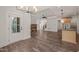 Open-concept living space showcasing a kitchen island, fireplace, and an entryway, creating a welcoming atmosphere at 390 Pilot Ridge Rd, Zebulon, NC 27597