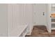 Mudroom features a built-in bench, storage, and wood-look floors, blending functionality and style at 390 Pilot Ridge Rd, Zebulon, NC 27597