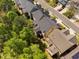 Aerial view of the back of homes featuring well-maintained lawns and mature trees at 4121 Enfield Ridge Dr, Cary, NC 27519