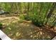 Large backyard with green grass and abundant trees at 4121 Enfield Ridge Dr, Cary, NC 27519