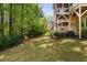 Beautiful backyard space surrounded by lush greenery and trees; home boasts double, screened-in porches at 4121 Enfield Ridge Dr, Cary, NC 27519