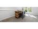Rustic bar with wooden finish, seating for two, and a convenient serving ledge provides a stylish spot for drinks at 4121 Enfield Ridge Dr, Cary, NC 27519