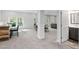 Open basement area features carpet, a bar, and separate seating and dining areas at 4121 Enfield Ridge Dr, Cary, NC 27519