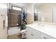 Bright bathroom features a tub with tile surround and a single sink vanity at 4121 Enfield Ridge Dr, Cary, NC 27519