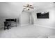 Bedroom with vaulted ceiling features carpet, ceiling fan, and a television at 4121 Enfield Ridge Dr, Cary, NC 27519