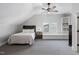 Bedroom features a vaulted ceiling, carpet, a bed, night stand and window bench at 4121 Enfield Ridge Dr, Cary, NC 27519