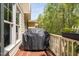 Deck with a grill and green tree view at 4121 Enfield Ridge Dr, Cary, NC 27519