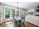 Sunlit dining area with hardwood floors and views to the outside at 4121 Enfield Ridge Dr, Cary, NC 27519