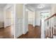 Elegant foyer with hardwood floors, white wainscoting, and a staircase at 4121 Enfield Ridge Dr, Cary, NC 27519