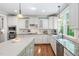 Open kitchen design with a center island, stainless steel appliances, and ample cabinet space at 4121 Enfield Ridge Dr, Cary, NC 27519