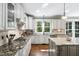 Well-designed kitchen with granite counters, stainless steel appliances, and a central island at 4121 Enfield Ridge Dr, Cary, NC 27519