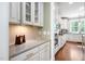 Elegant kitchen showcasing white cabinets, granite counters, and stainless steel appliances at 4121 Enfield Ridge Dr, Cary, NC 27519